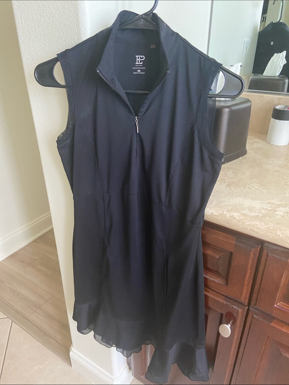 Black Sleeveless Zip-Front Dress with Flounce Hem